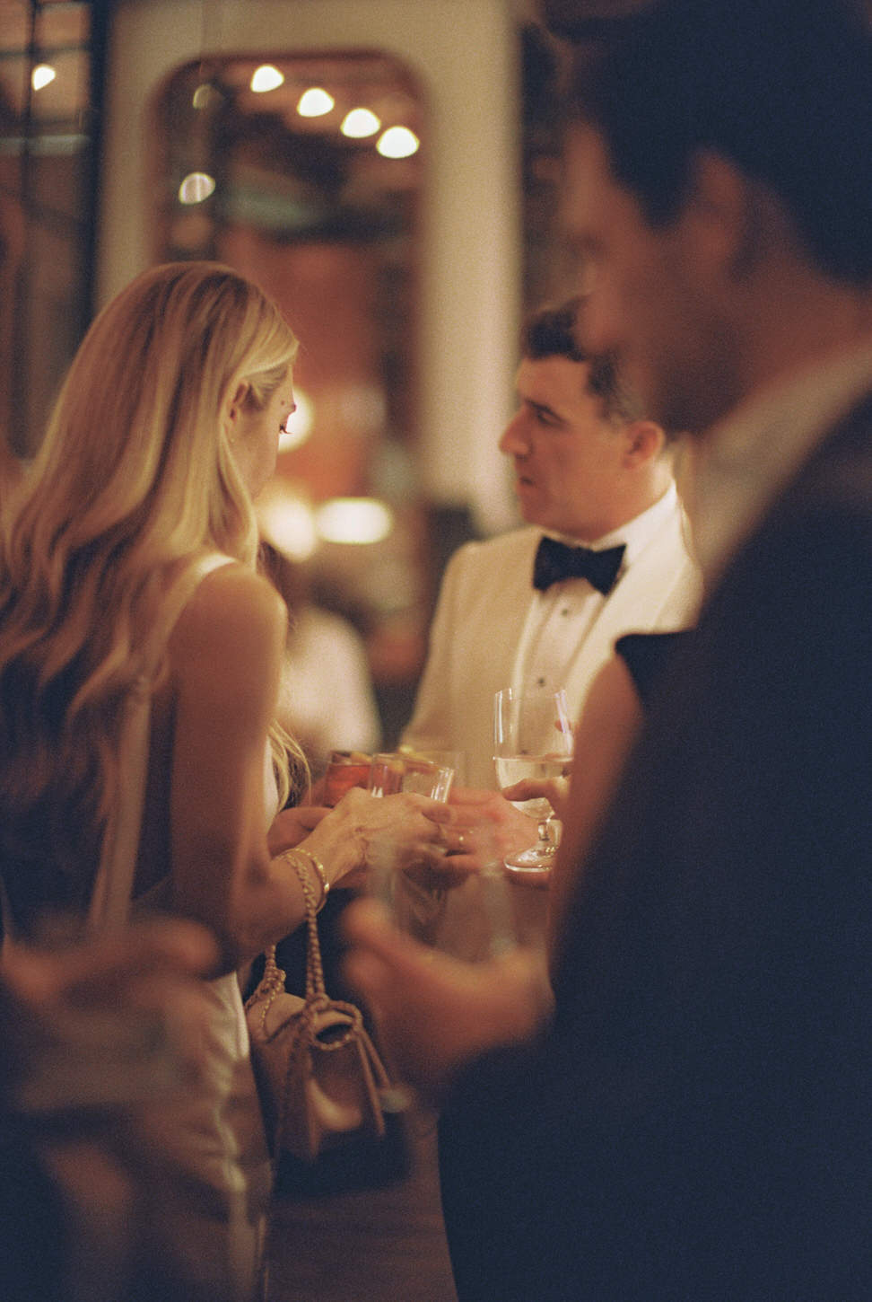 The newlyweds mingle with guests in a dreamlike wedding photo image captured by Jenny Fu Studio.