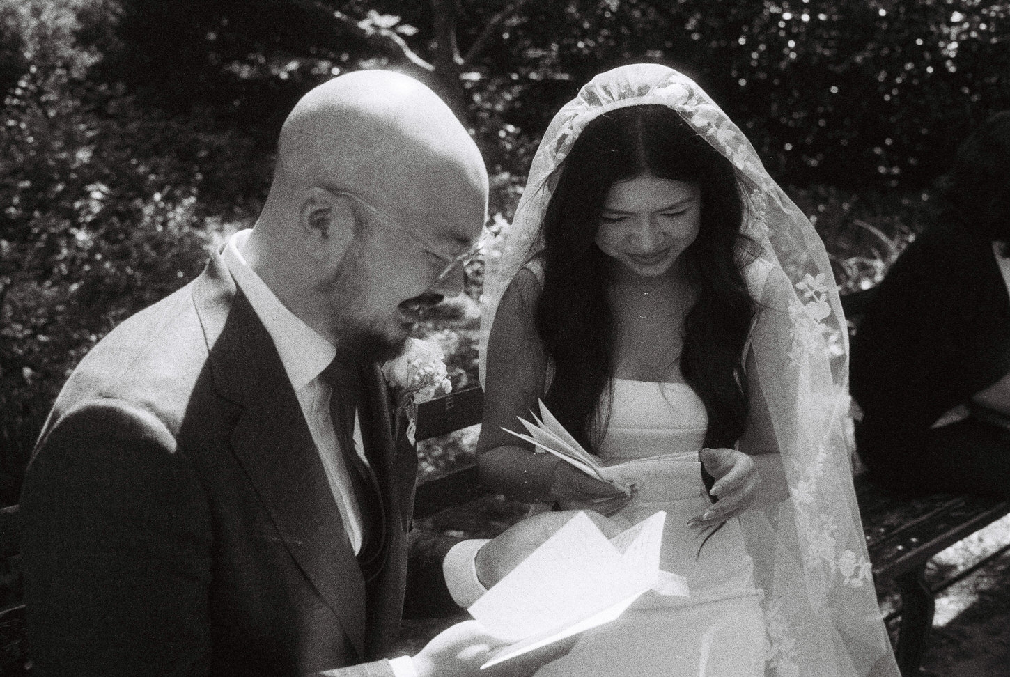 The bride and groom are reading the letters they gave to each other before the wedding ceremony, captured by Jenny Fu Studio, in film editorial photography.