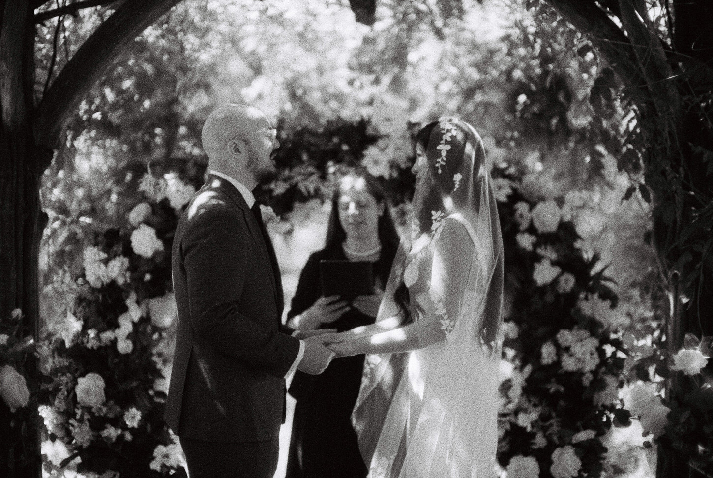 Black and white, editorial film photo of the wedding ceremony beautifully captured by Jenny Fu Studio.