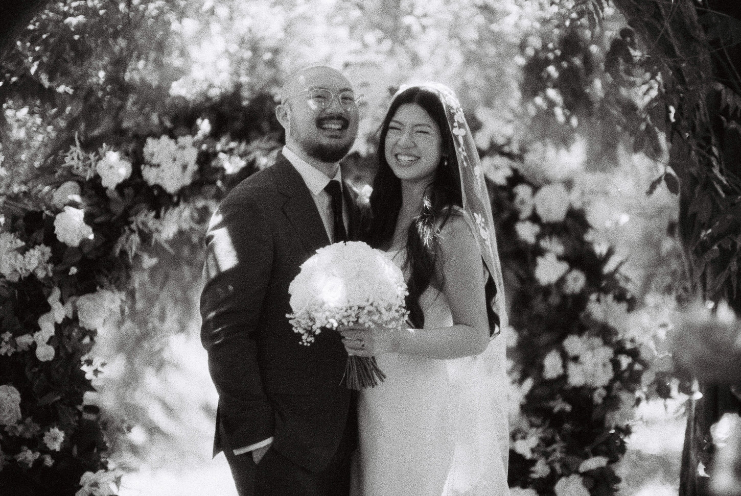 A happy portrait of the newlyweds captured by Jenny Fu Studio.