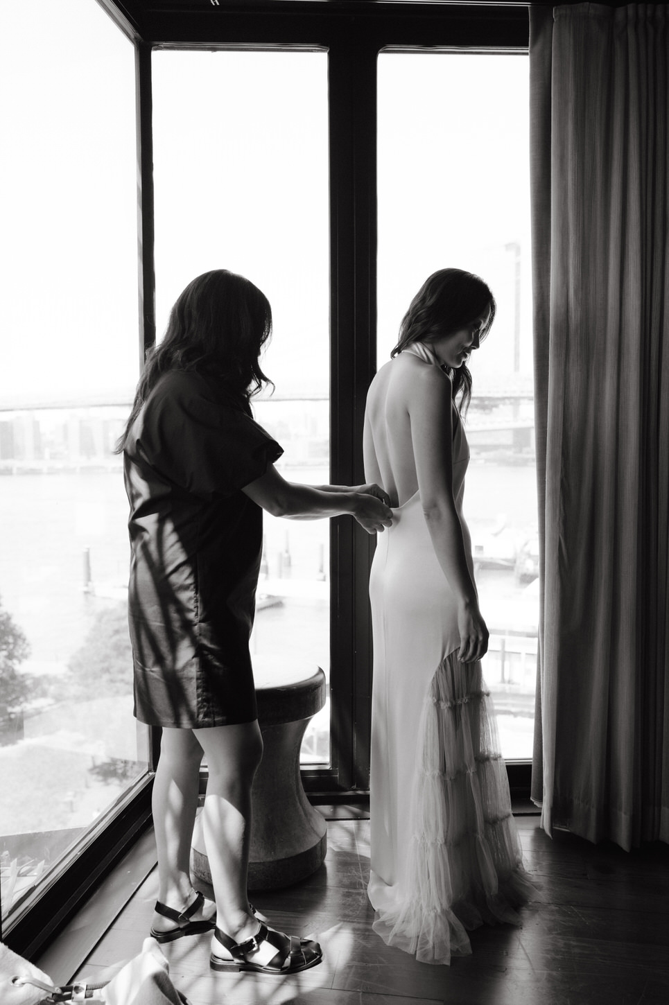 Black and white, candid getting-ready image of the bride for the cinematic wedding storytelling photography by Jenny Fu Studio.