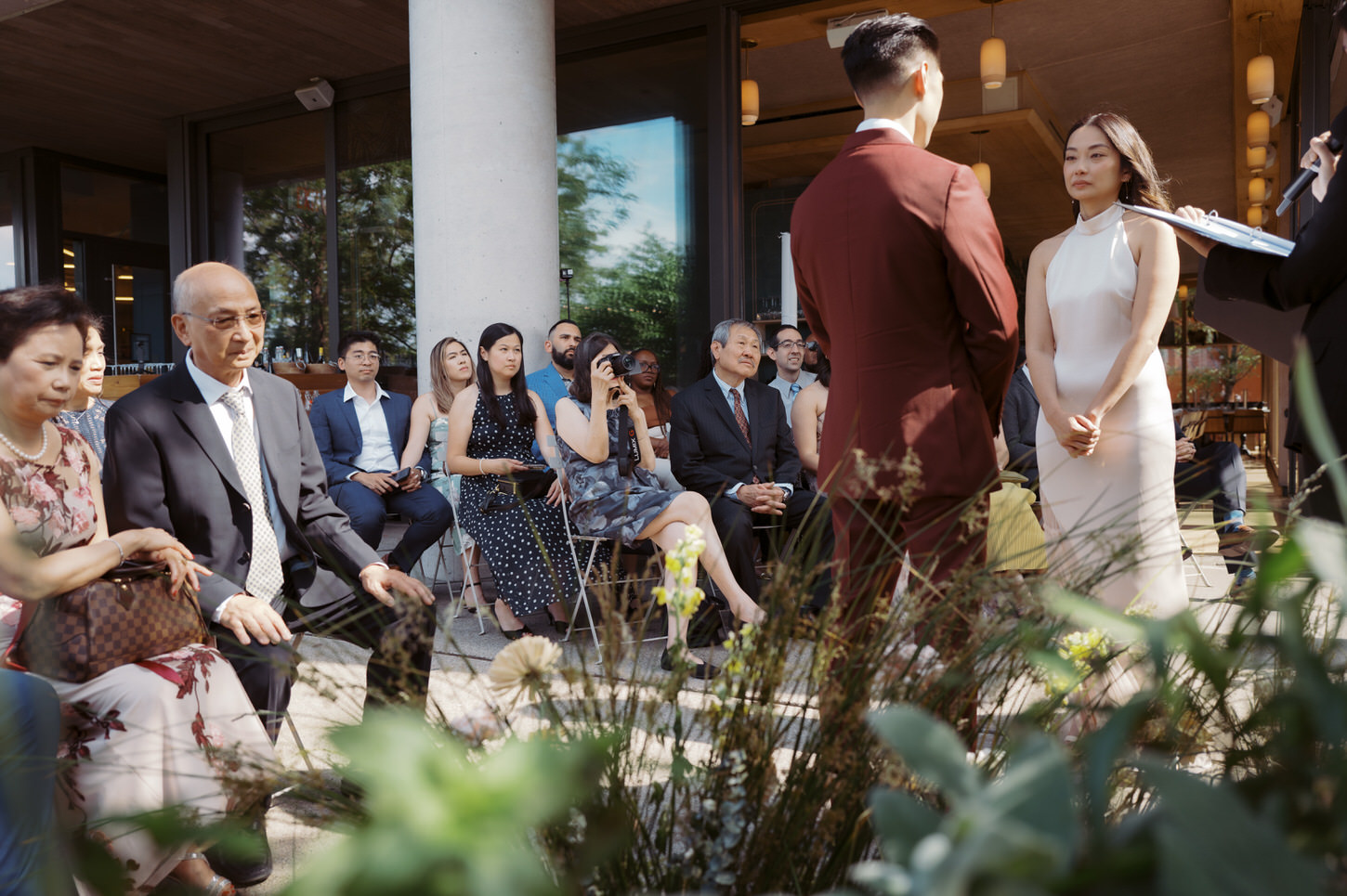 The bride is emotional in the wedding ceremony captured by Jenny Fu Studio.