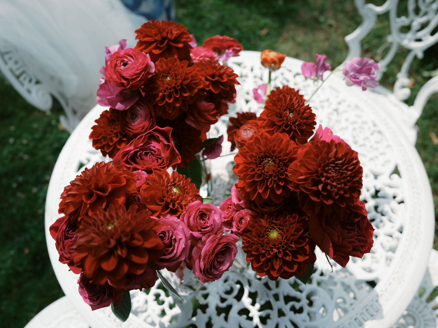 Beautiful flowers in shades of dark red, pink and magenta for an Upstate New York wedding, captured by Jenny Fu Studio.