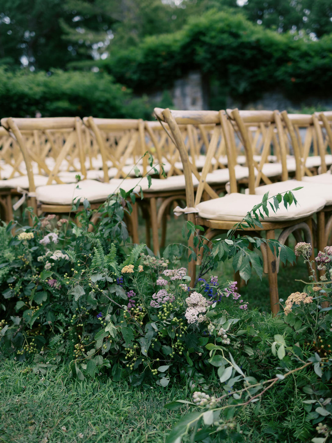 Rows of elegant seats for a wedding ceremony outdoors captured by high-fashion wedding photographer, Jenny fu Studio.