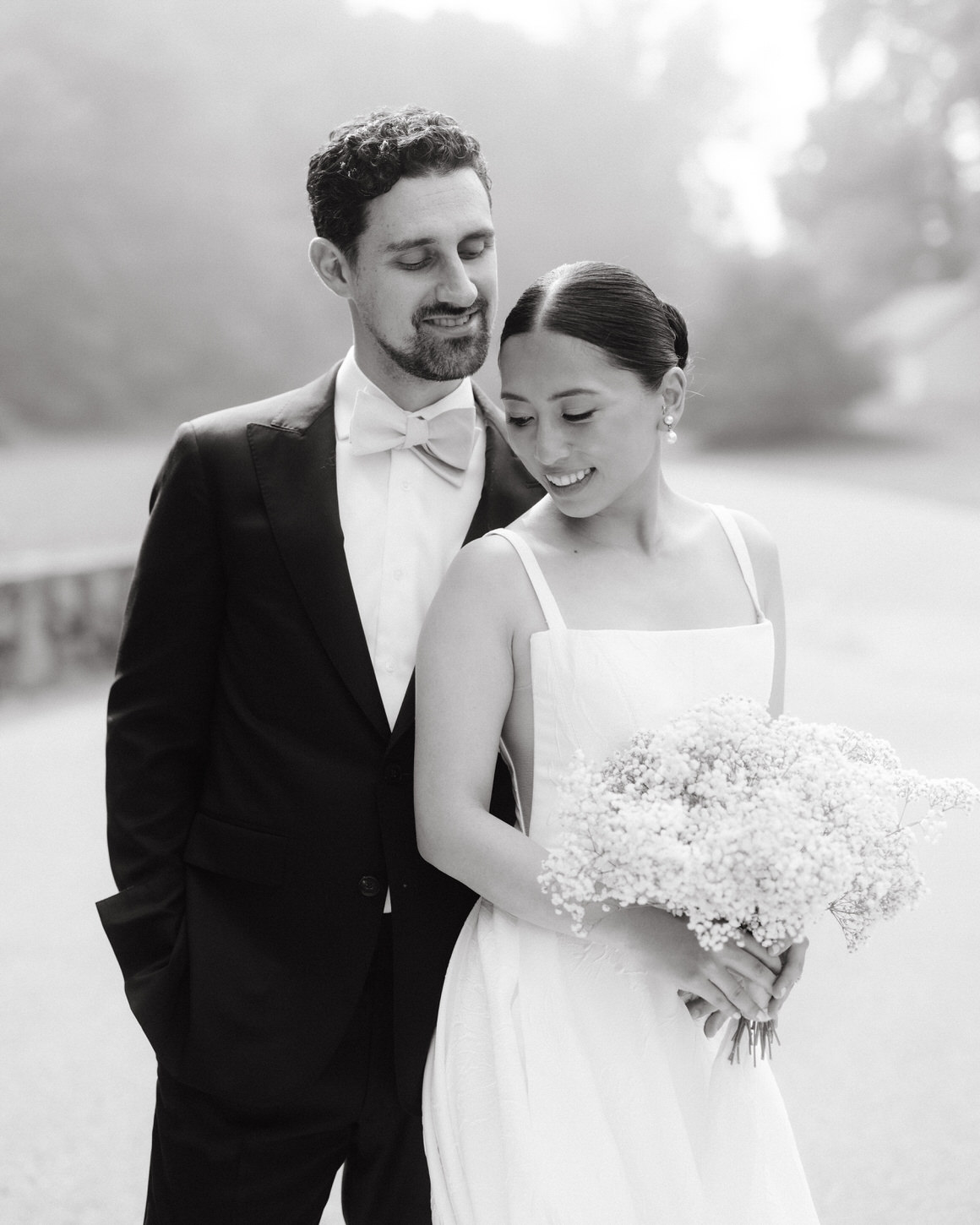 Black and white, elegant editorial portrait of the  bride and groom, dreamlike wedding photos captured by Jenny Fu Studio NYC.