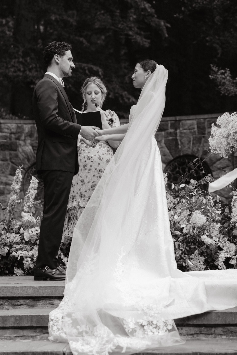 An intimate wedding ceremony moment captured in black and white, candid, dreamlike wedding photos by Jenny Fu Studio. 