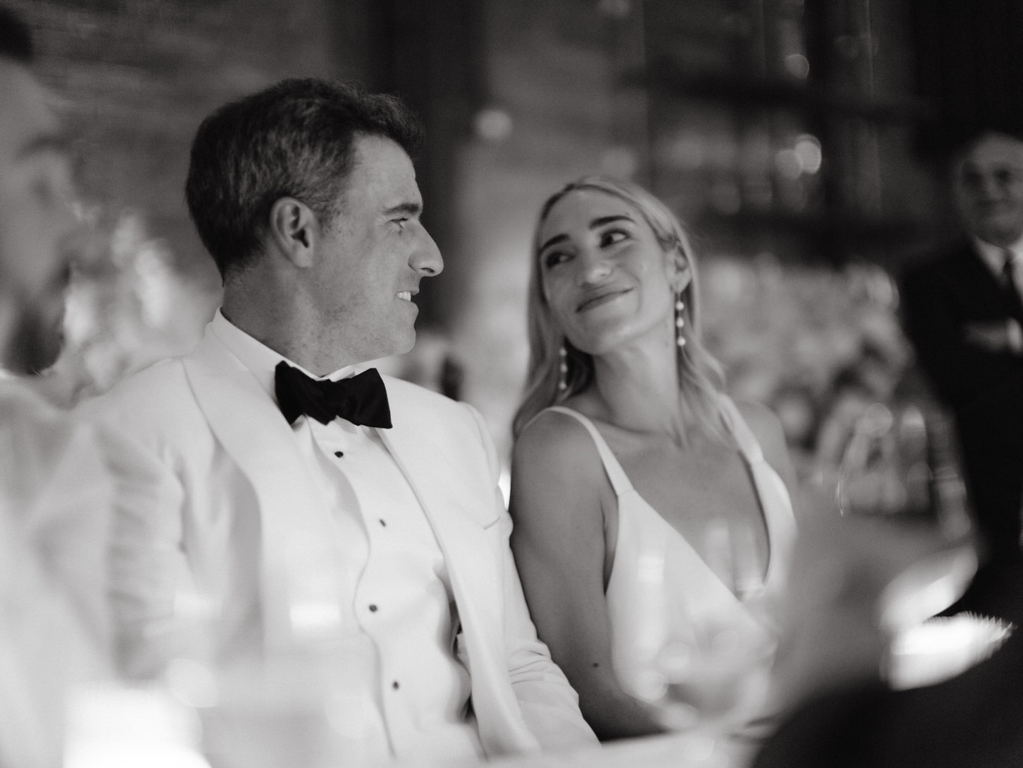 The newlyweds share a loving gaze, captured in soft black and white by editorial wedding photographer,  Jenny Fu Studio NYC.