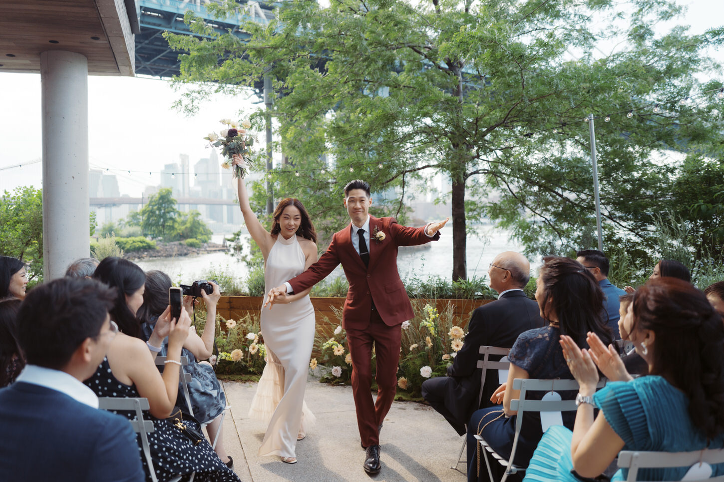 The newlyweds joyfully exits the wedding ceremony as the guests cheers them, candidly captured by Jenny Fu Studio, NYC.