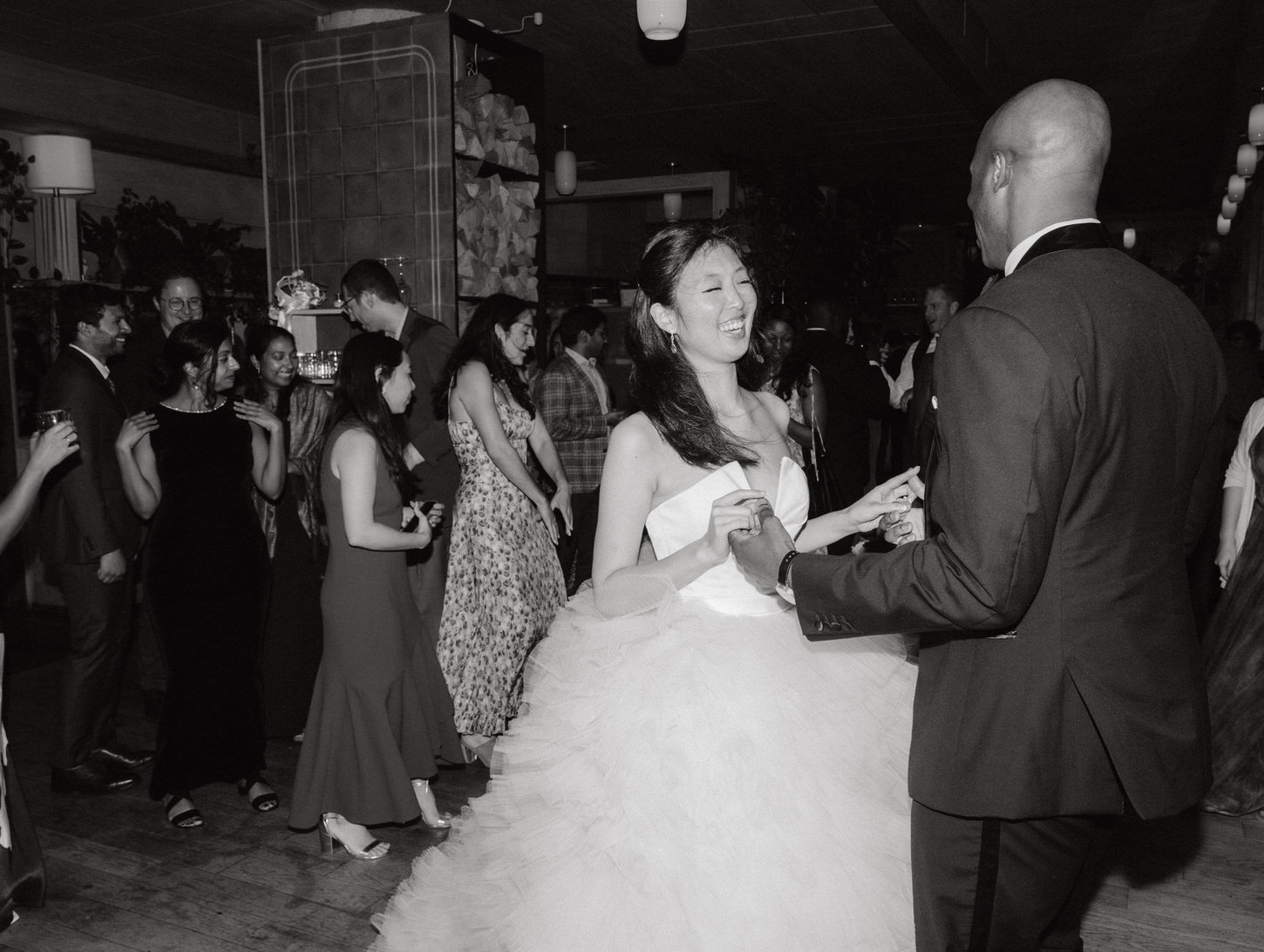 Black and white first dance photo of the newlyweds, captured by Jenny Fu Studio.